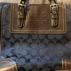 Navy blue Coach purse and matching wallet.